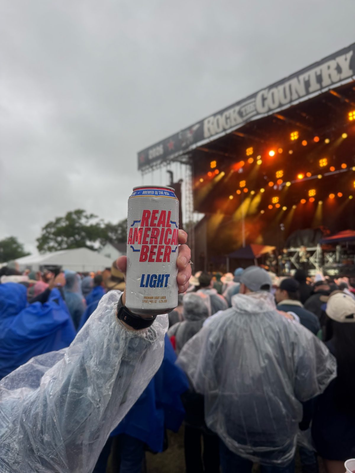 Fan holding a Real American Beer in the crowd
